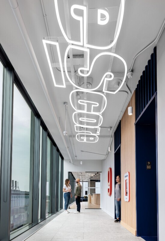 theScore Toronto office featuring Agilis acoustic baffle ceiling and custom logo lighting.