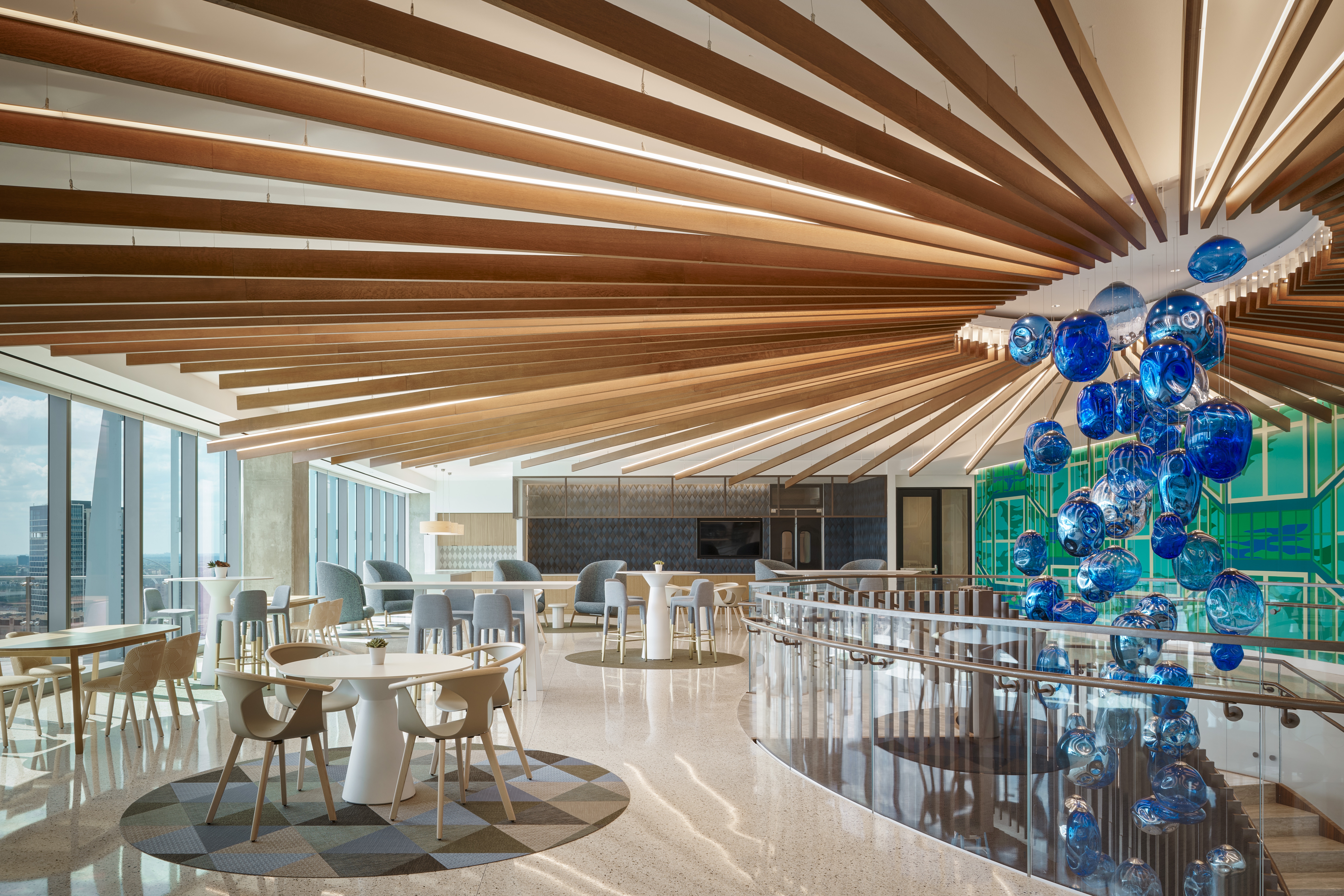 Haynes Boone office showcasing a Tignum traditional starburst wood ceiling with a blue glass chandelier.