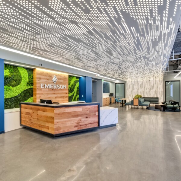 Emerson Electric office reception featuring Agilis backlit perforated wall and ceiling panels.
