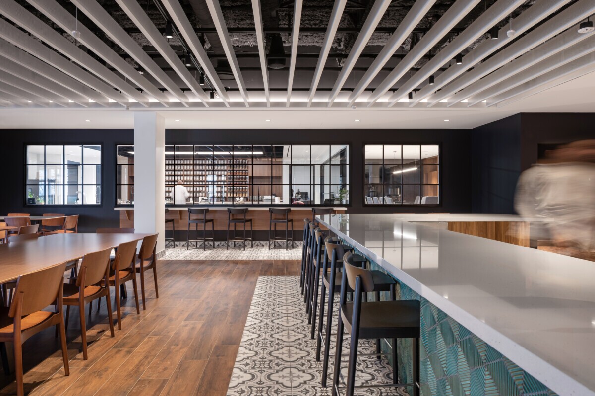 Open-concept Mother Parkers cafe highlighting the Agilis perforated baffle ceiling design.
