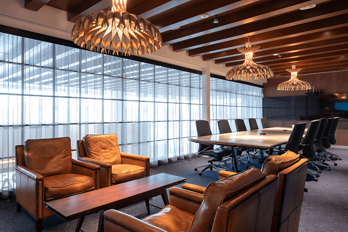 Mother Parkers boardroom featuring Agilis woodgrain ceiling baffles above a long conference table.