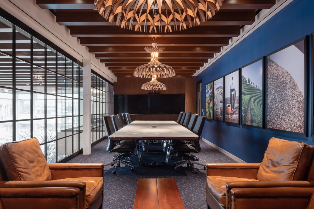 Wide view of Mother Parkers boardroom with Agilis woodgrain ceiling baffles and modern furniture.