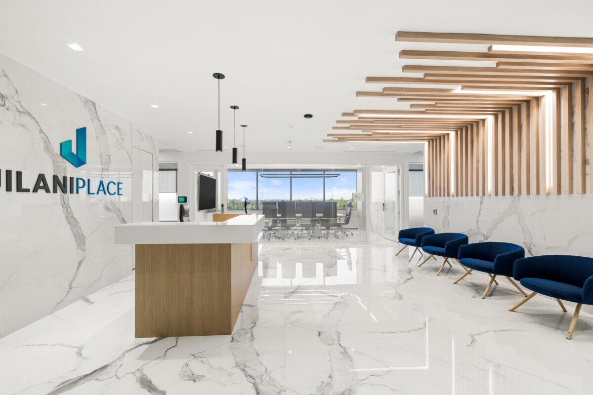 Perspective shot of the entrance at Jilani Group featuring Agilis ceiling and wall slats.