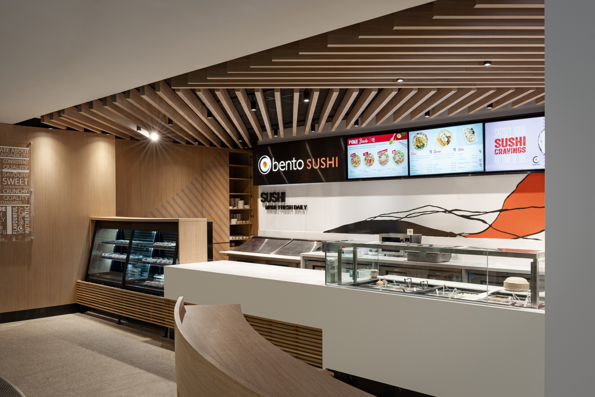Modern counter area at Bento Sushi with Agilis traditional wood-look baffle ceiling.