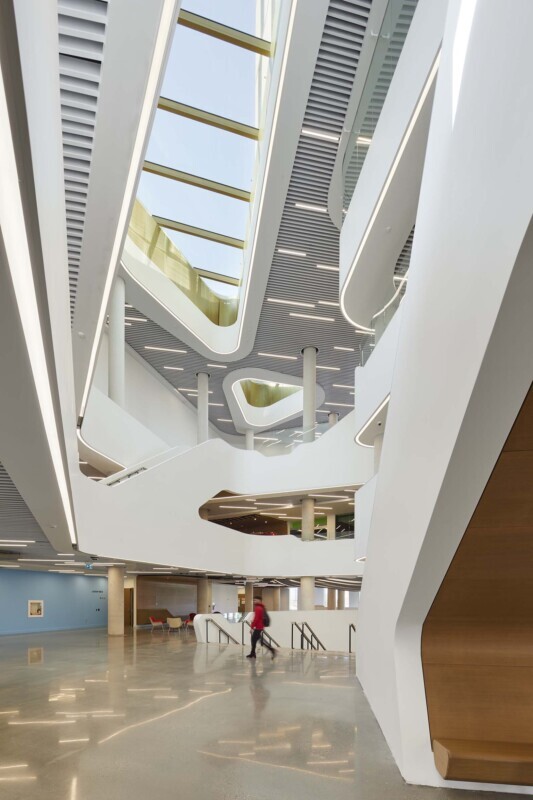 Brightly lit space at York University showcasing the Agilis perforated baffle ceiling system.