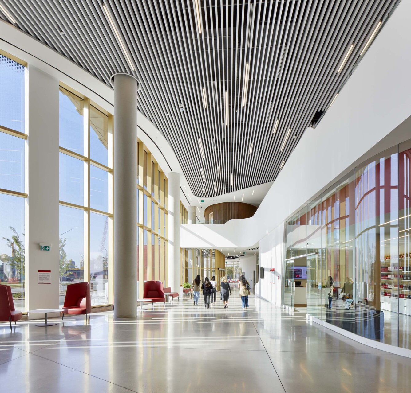 Agilis perforated baffles installed across a wide corridor at York University Markham Campus.