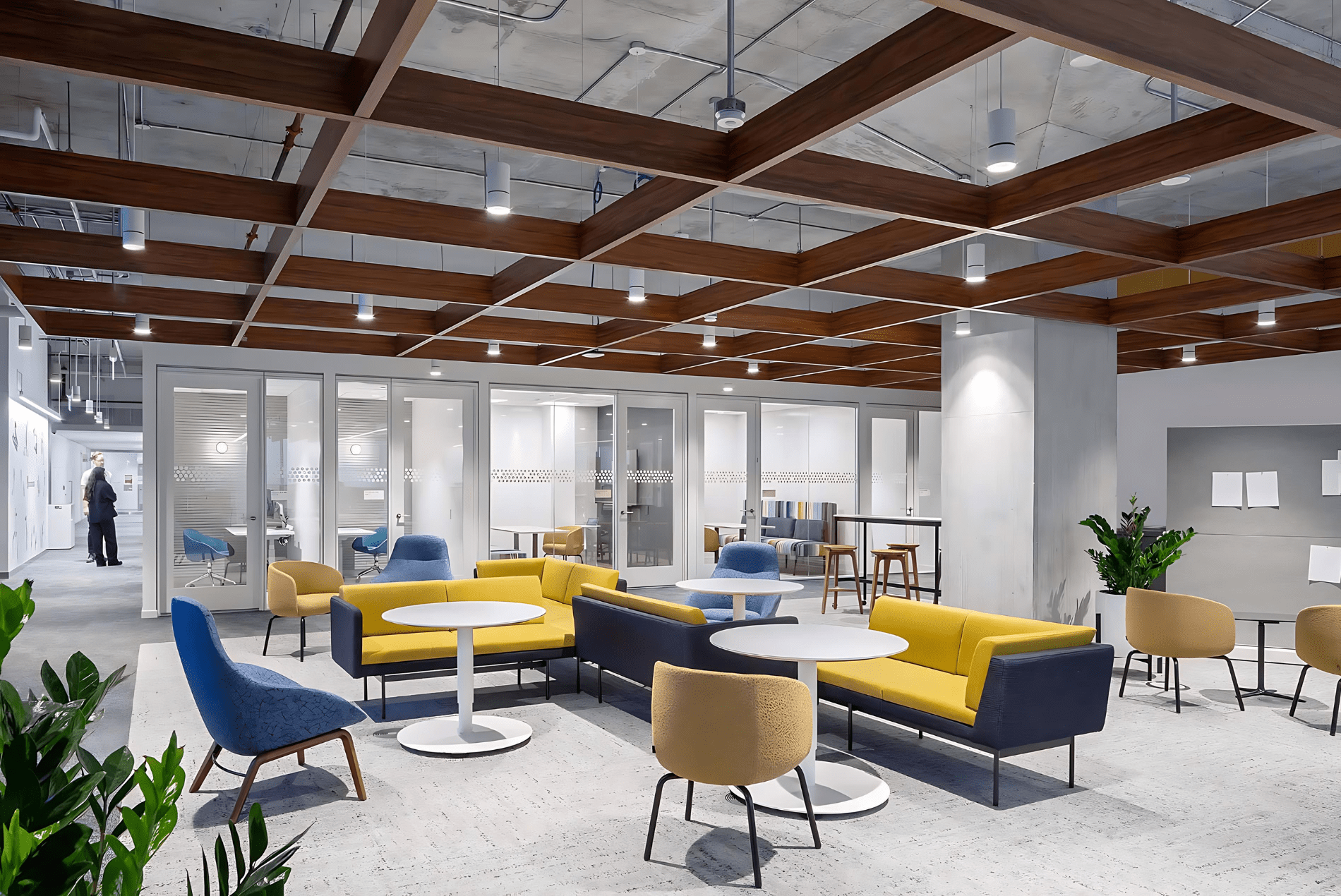 Intuit office lounge displaying a Tignum traditional starburst wood ceiling with vibrant yellow and blue seating.