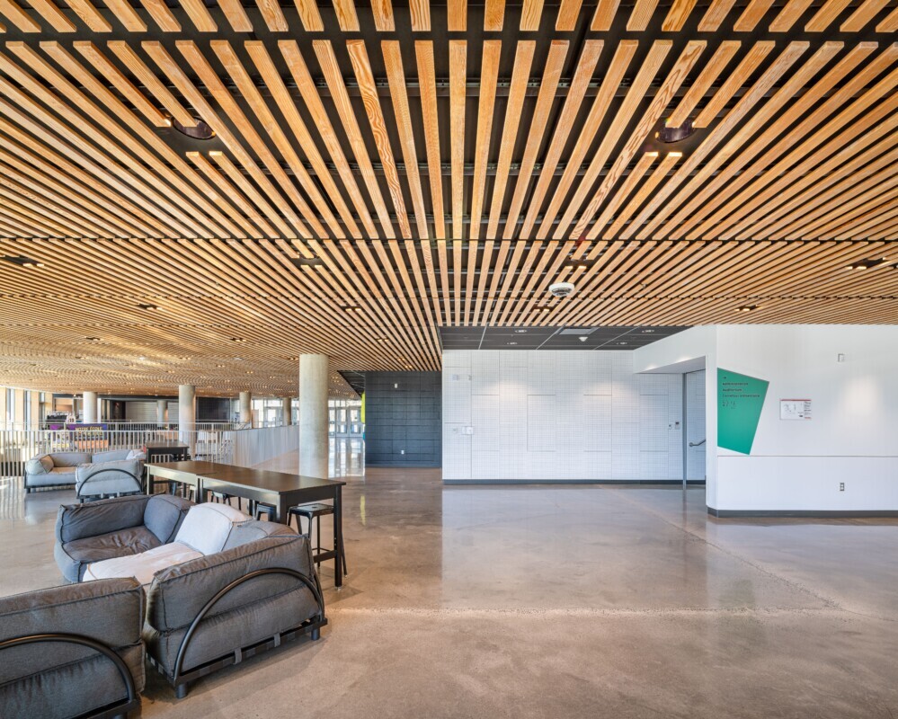 Custom wood LINE:Form Linear Planks system on the ceiling at a high school in Mirabel, California.