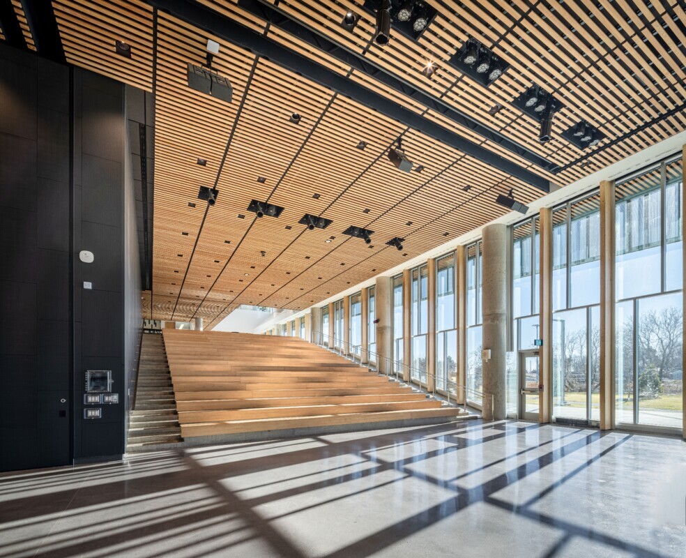 The Mirabel High School project using custom wood LINE:Form Linear Planks system on the ceiling.