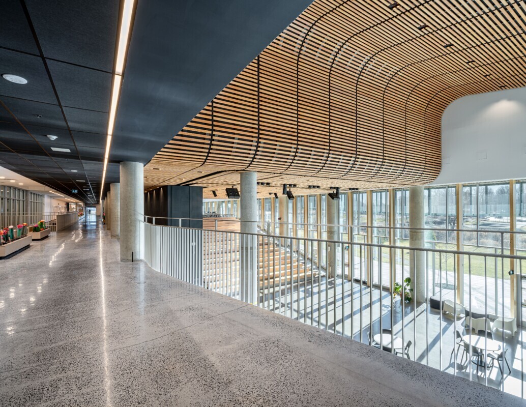 The Mirabel High School interior photo of a ceiling using Maxxit's custom wood LINE:Form Linear Planks system