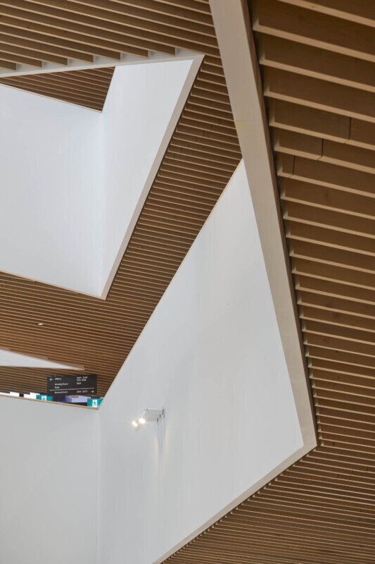 UBC, School of Biomedical Engineering in Vancouver, Canada features Maxxit’s custom LINE:Form Traditional Baffles in wood throughout the interior of the university.