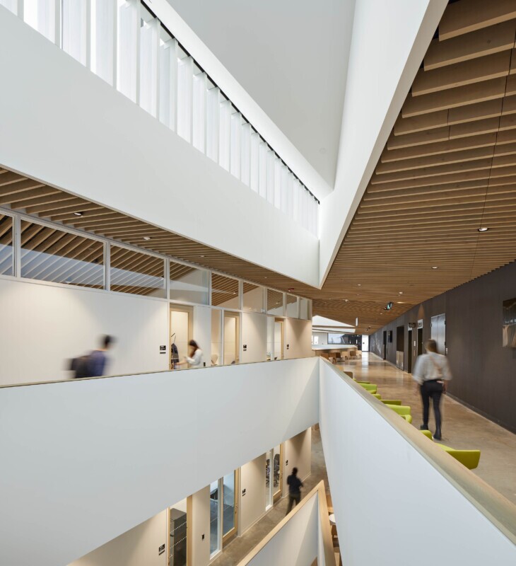 UBC, School of Biomedical Engineering in Vancouver, Canada features Maxxit’s custom LINE:Form Traditional Baffles in wood throughout the interior of the university.
