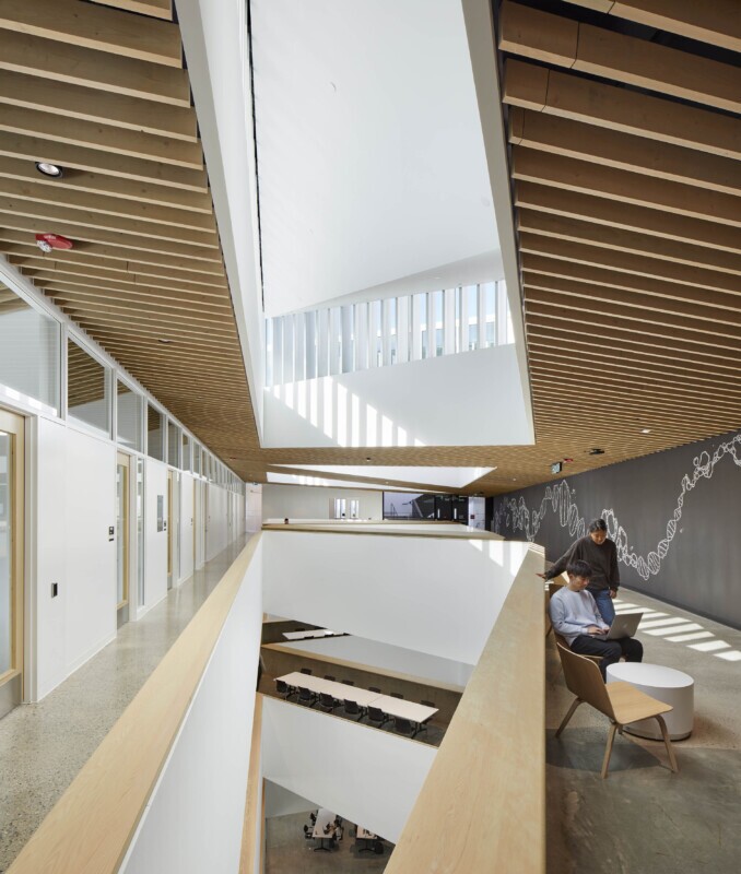 Higher angle of UBC, School of Biomedical Engineering in Vancouver, Canada features Maxxit’s custom LINE:Form Traditional Baffles in wood throughout the interior of the university. Creating a comfortable space for students to focus and study.