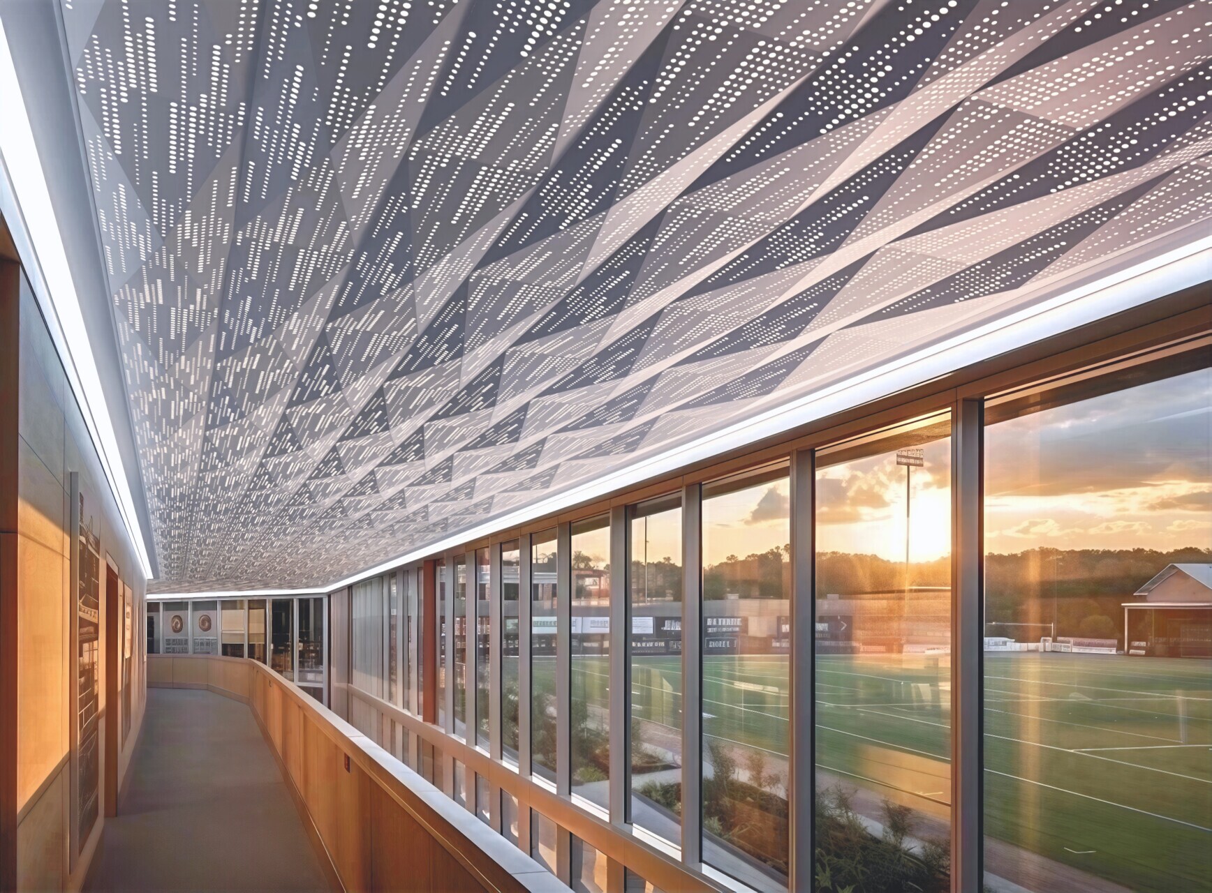 View of the interior of a building hallway that is using the perforated and lit PANEL: Form dimensional panel.