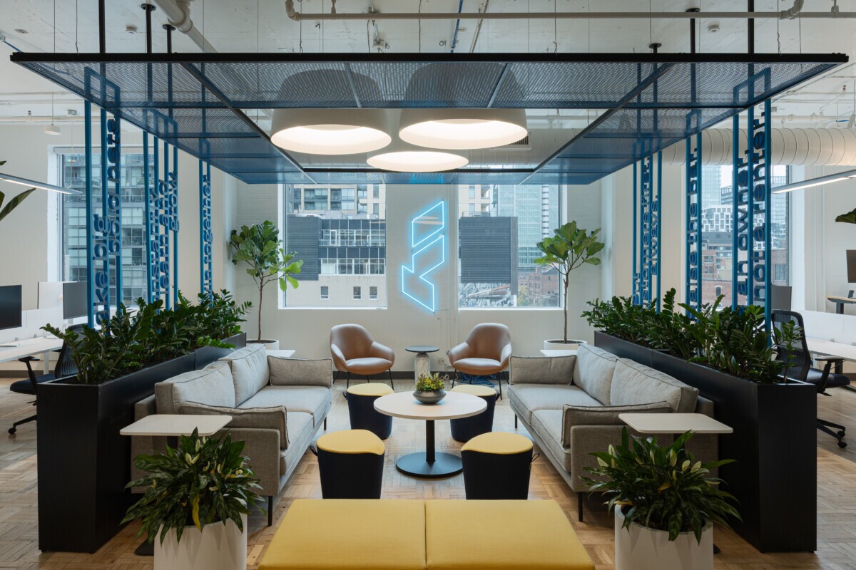 Close-up photo of Maxxit's PANEL:Form Metal Ceiling Panels above a lounge area in Float Financial's offices in Toronto