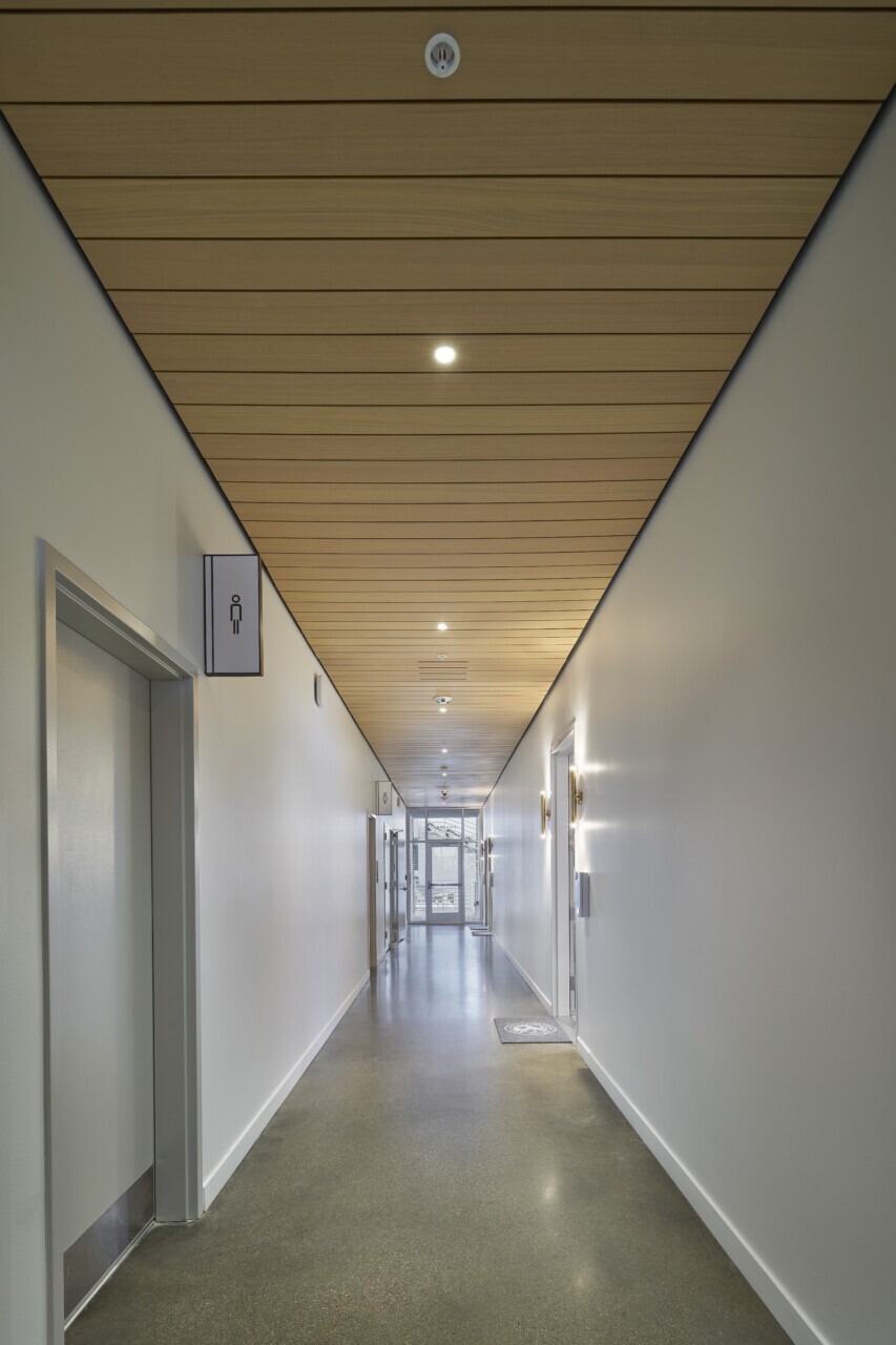 Maxxit LINE:form Linear Planks ceilings in the Lindner Family Tennis Center's Suites area and performance center