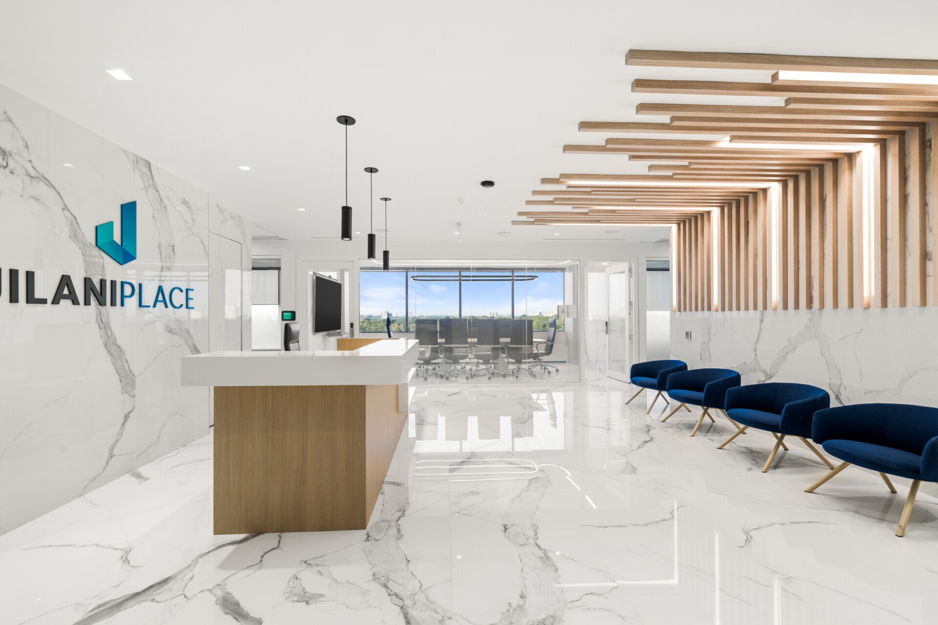 Perspective shot of the entrance at Jilani Group featuring Agilis ceiling and wall slats.