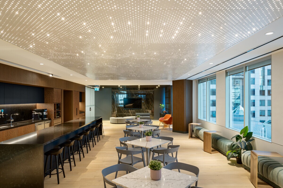Wide shot of Cresa office featuring integrated Agilis backlit ceiling illumination.