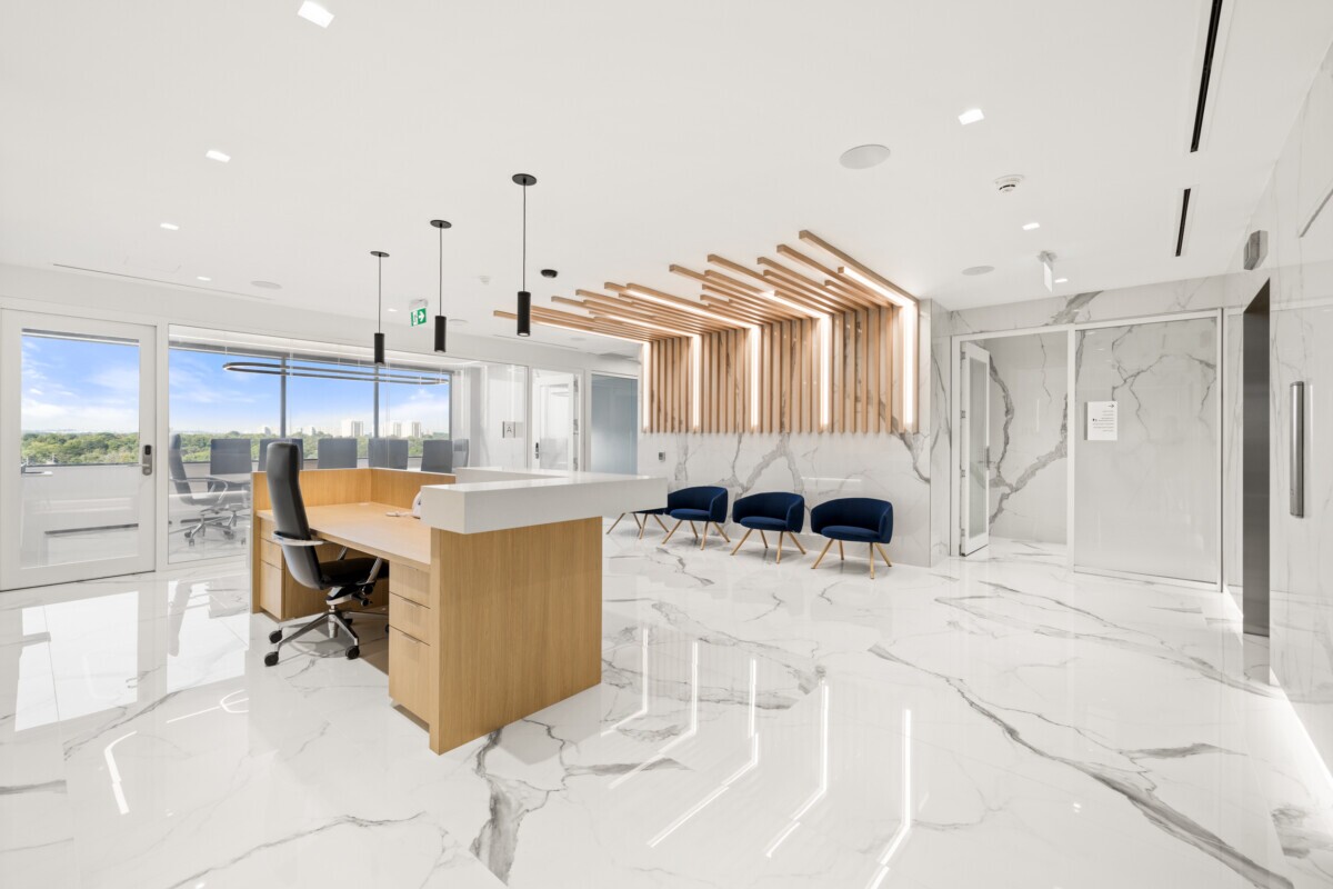 Angled view of Jilani Group reception featuring decorative Agilis ceiling and wall slats.