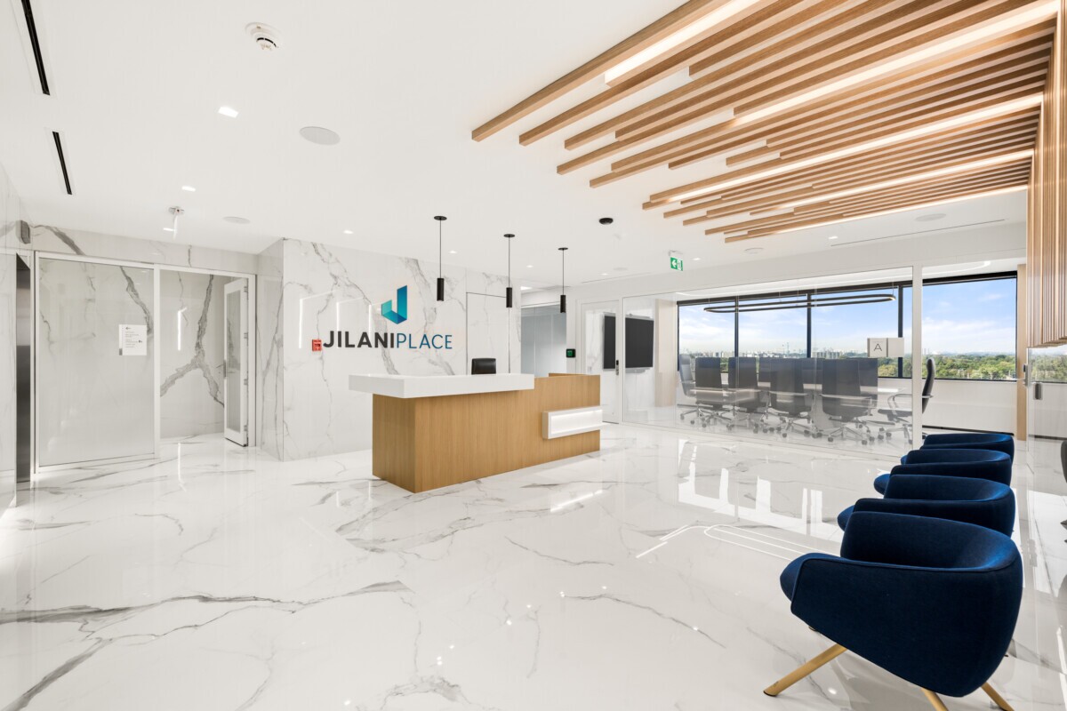 Main reception at Jilani Group with a custom Agilis ceiling and wall installation.