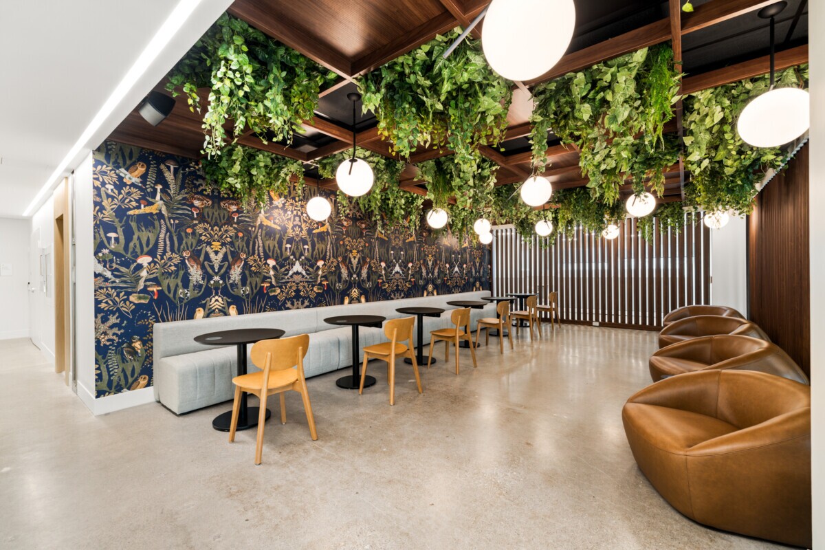 Jilani Group cafe featuring Agilis Networks open-cell perforated acoustic ceiling panels.