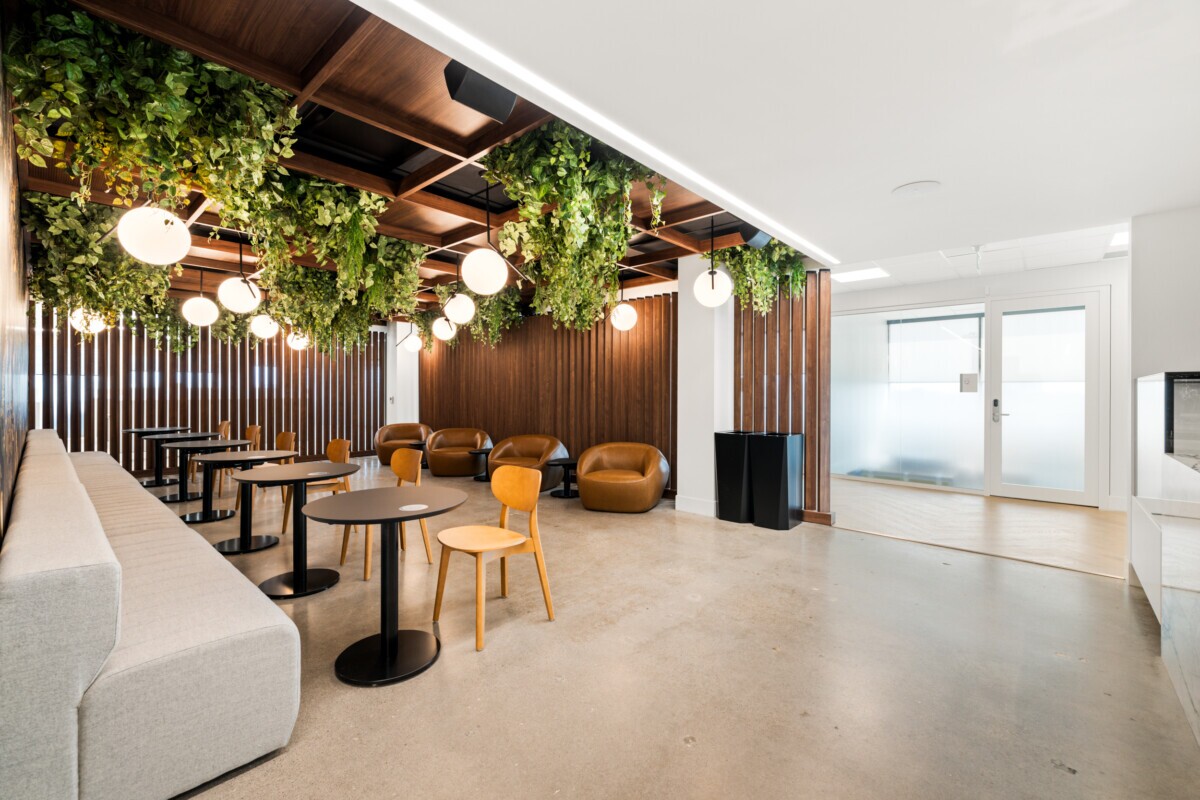 Jilani Group lounge area featuring woodgrain Agilis acoustic ceiling and Protero wall slats.