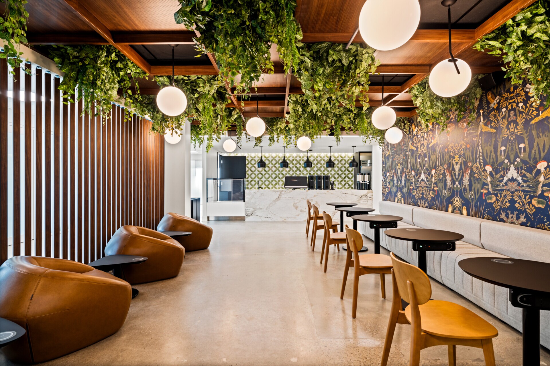 Wide view of Jilani Group cafe with Agilis Networks open cell ceiling design.
