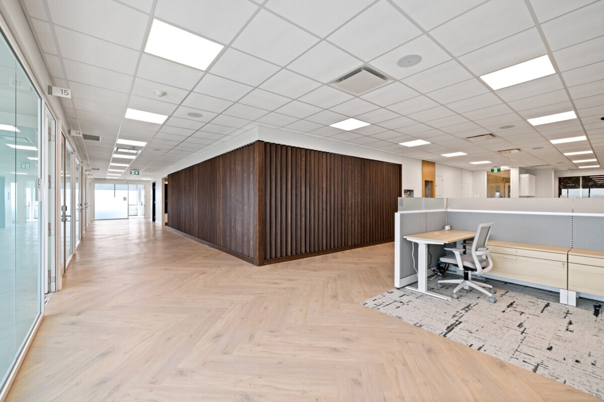 Jilani Group office featuring a Protero vertical wall slat partition in wood finish.