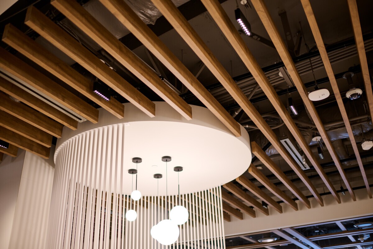 Detailed shot of Protero traditional baffles highlighting the woodgrain finish at World Exchange Plaza