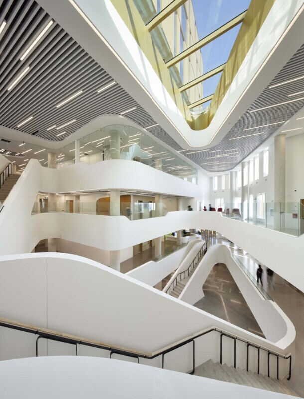 Angled shot of Agilis perforated baffles in a York University Markham Campus common area.
