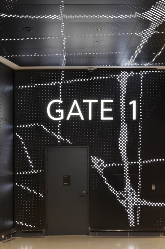 Scotiabank Arena Gate 1 entrance featuring Agilis backlit, custom-perforated wall panels with glowing map design.