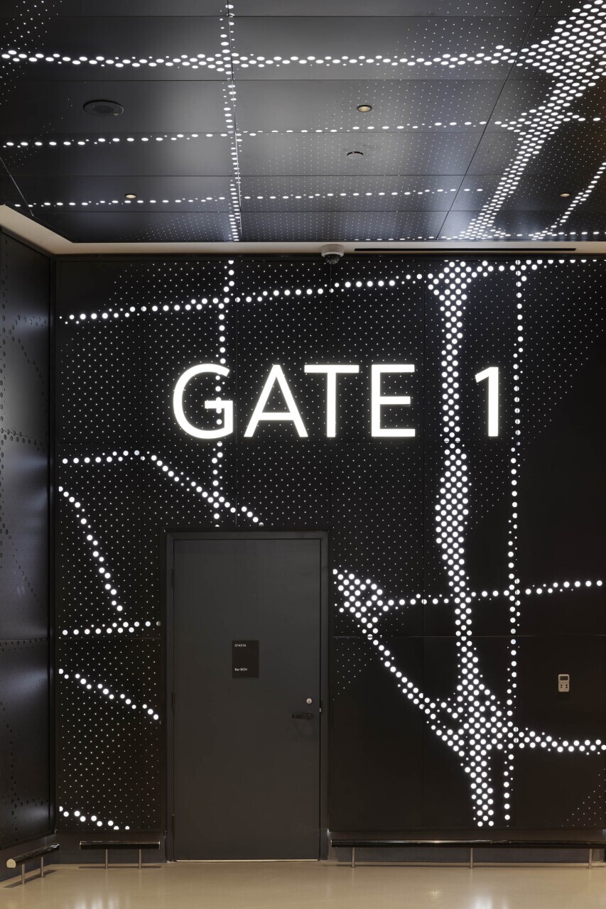Scotiabank Arena Gate 1 entrance featuring Agilis backlit, custom-perforated wall panels with glowing map design.