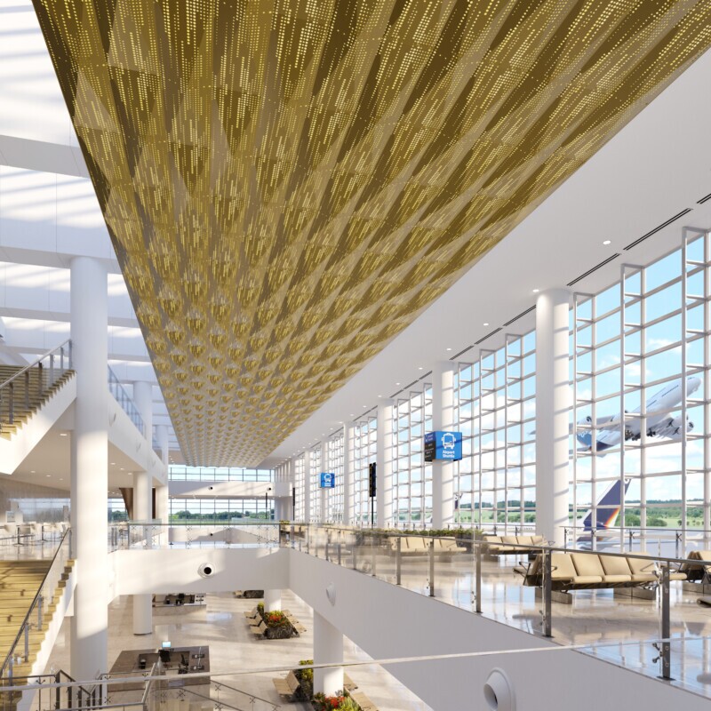 Interior of airport showcasing the perforated PANEL:Form dimensional panel in a gold tone