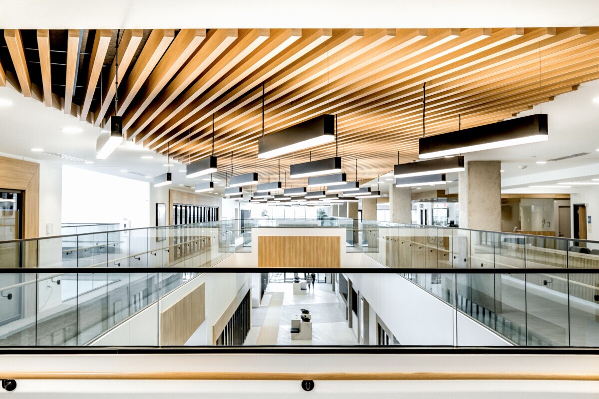 A photo of a beatiful healthcare space with Maxxit's LINE:Form Traditional Baffles finished in Champagne Pine at Covenant Health Centre in Edmonton, CA