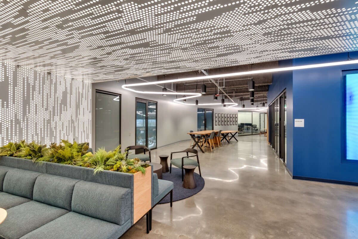Emerson Electric office reception featuring Agilis backlit perforated wall and ceiling panels.