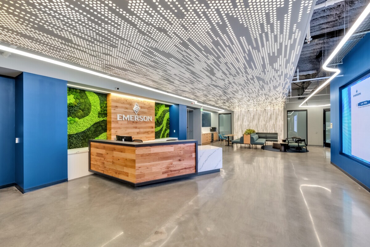 Emerson Electric office reception featuring Agilis backlit perforated wall and ceiling panels.
