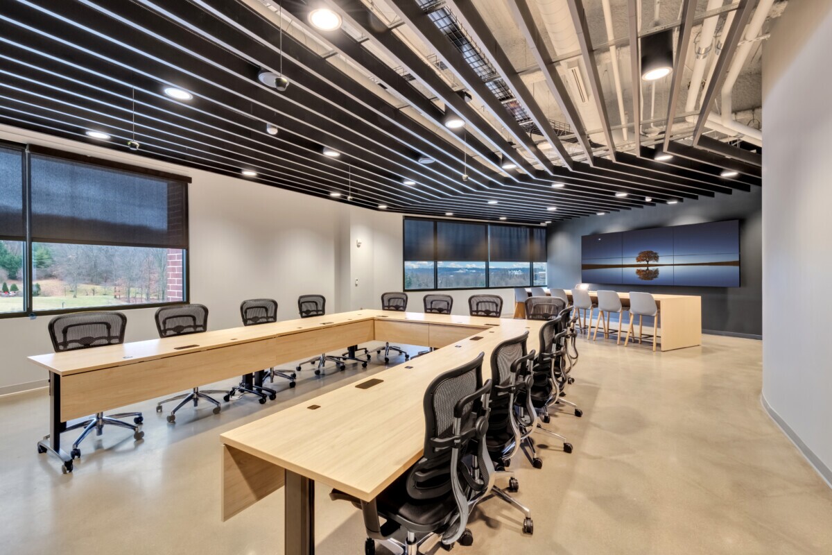 Emerson Electric conference room featuring an Agilis traditional perforated baffle ceiling system with integrated lighting.