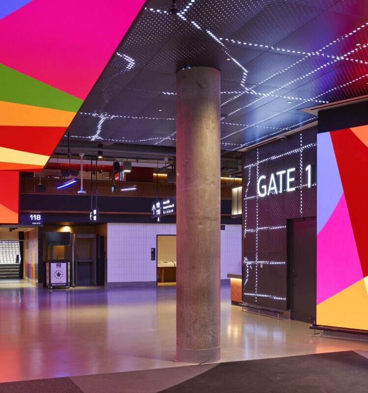 Scotiabank Arena concourse featuring Agilis backlit perforated ceiling panels and Gate 1 signage.