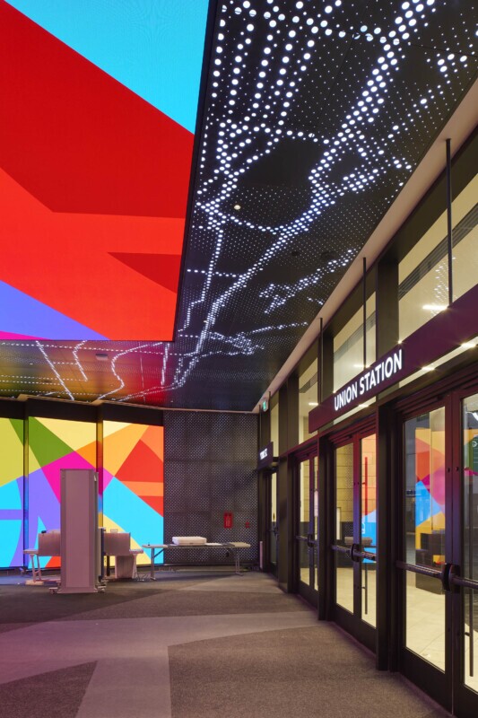 Scotiabank Arena Union Station entrance featuring Agilis backlit perforated ceiling and vibrant LED walls.