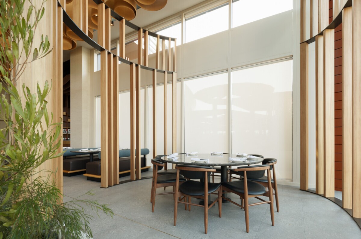 View of the interior of Din Tai Fung dining room in Santa Monica, California. Showcasing Maxxit's wave partitions to separate sections of the dining room.