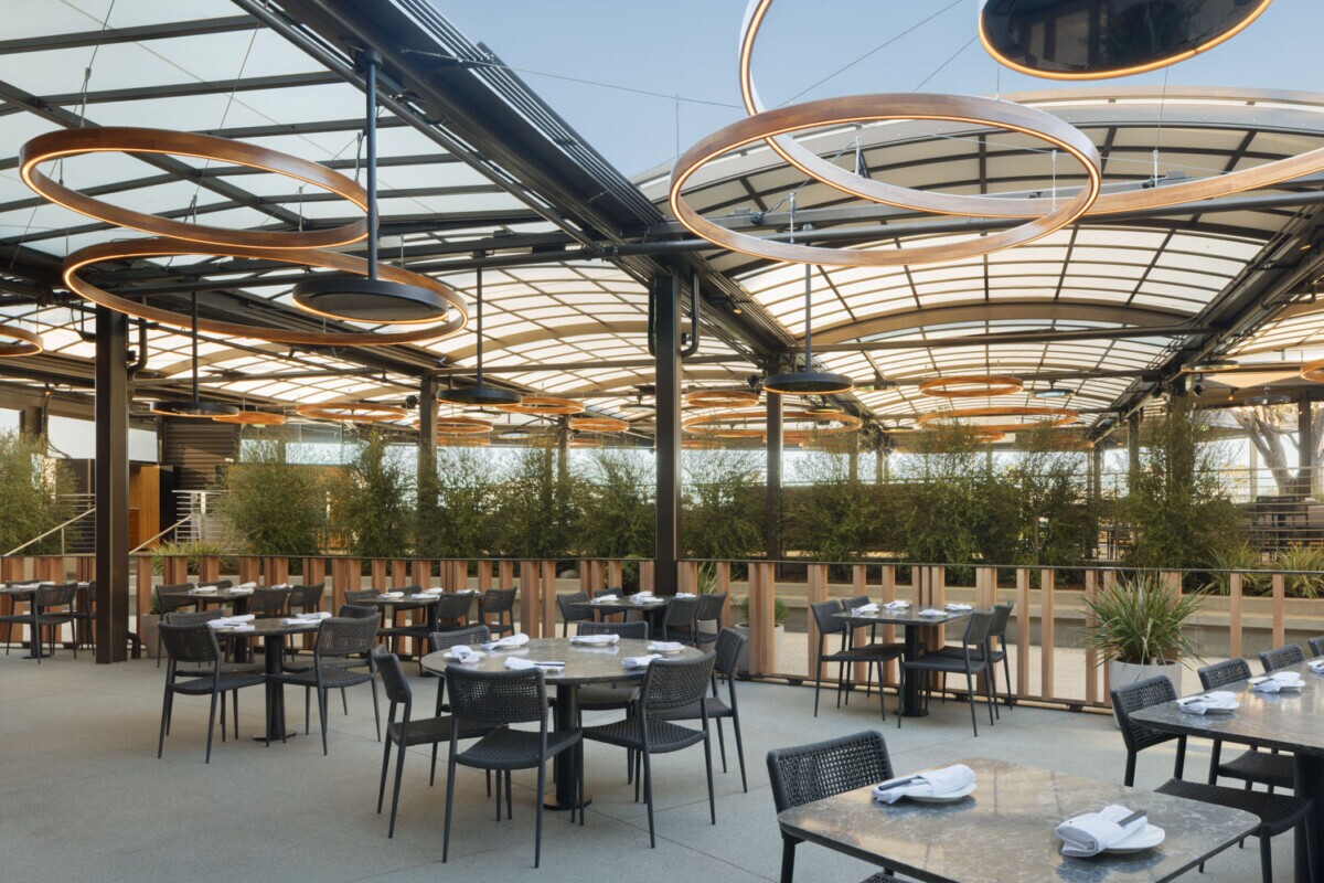 View of the exterior patio dining area of Din Tai Fung in Santa Monica, California. Showcasing Maxxit's exterior custom railing feature.