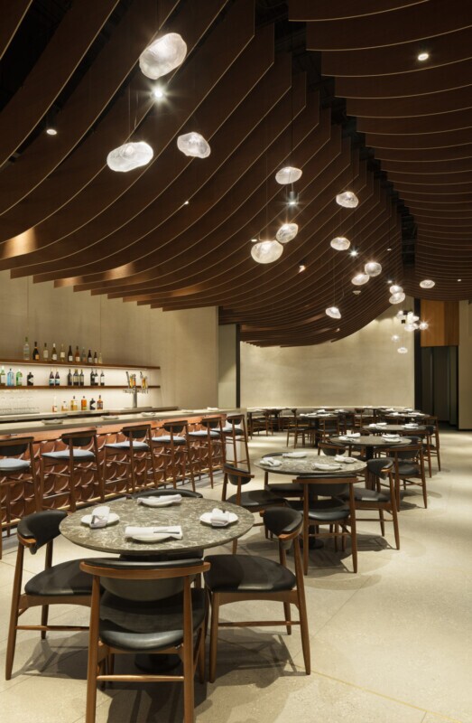 View of the interior of Din Tai Fung dining room in Santa Monica, California. Showcasing Maxxit's wave ceiling.