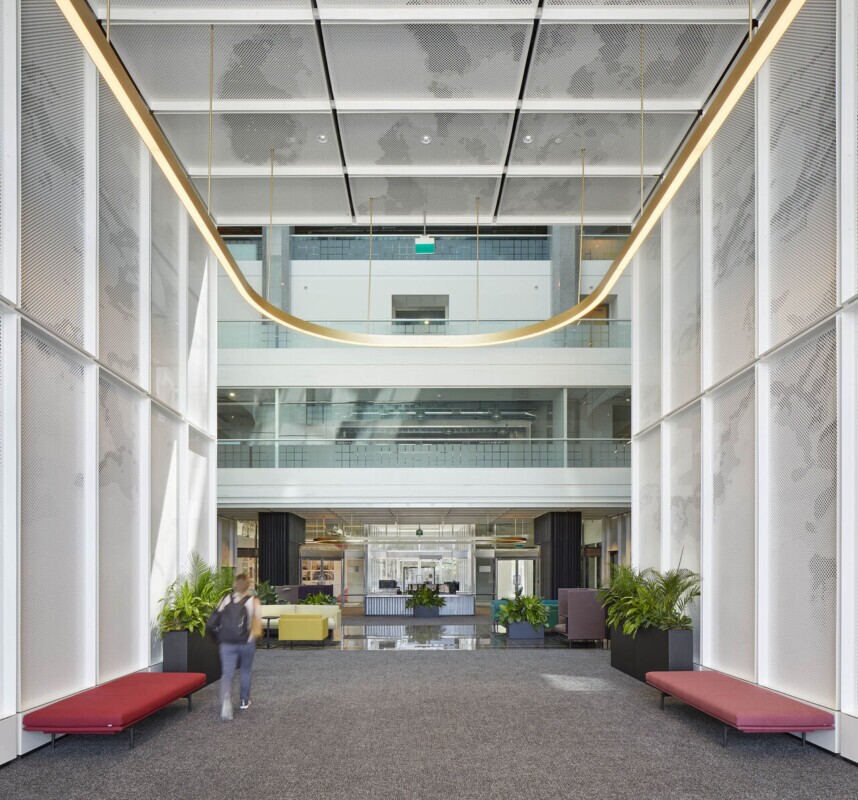 Lobby with PANEL:form design perforated ceiling wall panels in wallway into office